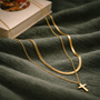 Collier croix double chaîne dorée