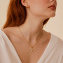 Collier croix grappe de cristaux dorée